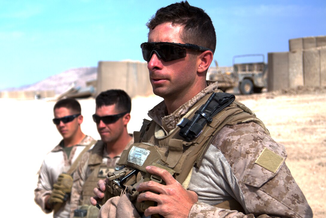 Capt. Michael Gagnon addresses his troops at Patrol Base Alcatraz, Afghanistan, at the conclusion of a successful mission, Oct. 21. Gagnon, a native of Oxford, Mass., commands a team of roughly 20 men dubbed “Task Force Nomad.” Over the next several weeks, the task force, a subset of Marine Wing Support Squadron 371, will construct or improve helicopter landing zones along the Helmand River valley in southwestern Afghanistan.
