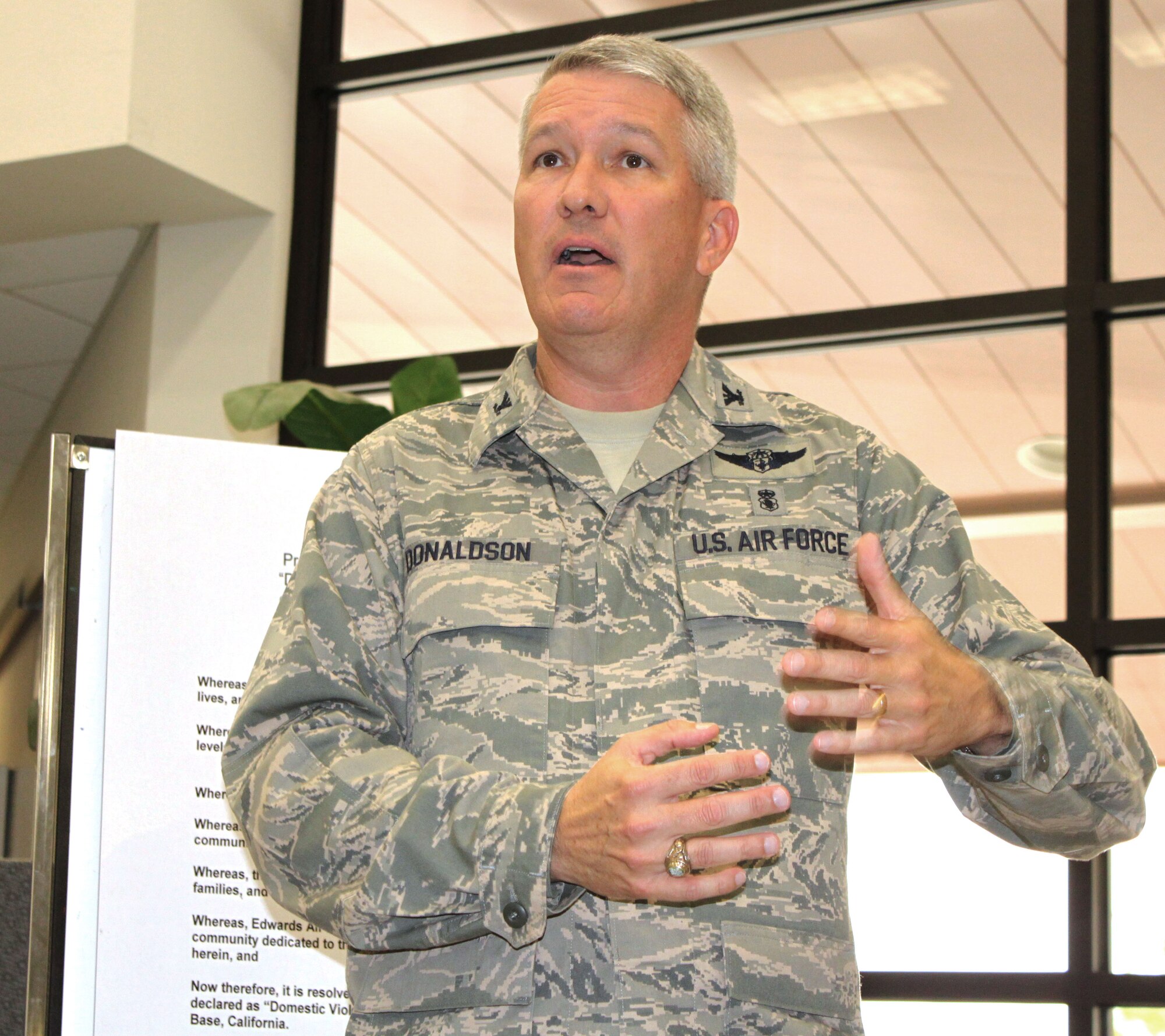 Col. Stephen K. Donaldson, commander, 95th Medical Group here addresses the audience during a proclamation signing here Oct. 5. The 95th Air Base Wing's proclamation officially declares October "Domestic Violence Awareness Month," at Edwards Air Force Base. (U.S. Air Force photo by Meredith Mingledorff) 