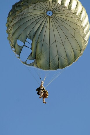 U.S. Air Force Staff Sgt. Jeffrey J. Madden, 820th RED HORSE airborne flight engineer journeyman, parachutes from a C-17 Globemaster III Oct. 15, 2011, at Nellis Air Force Base, Nev.  RED HORSE Airmen perform airdrop missions to stay current on training and certifications, enabling them to perform jump missions and operate their own drop zones. (U.S. Air Force photo by Staff Sgt. Taylor Worley/Released)
