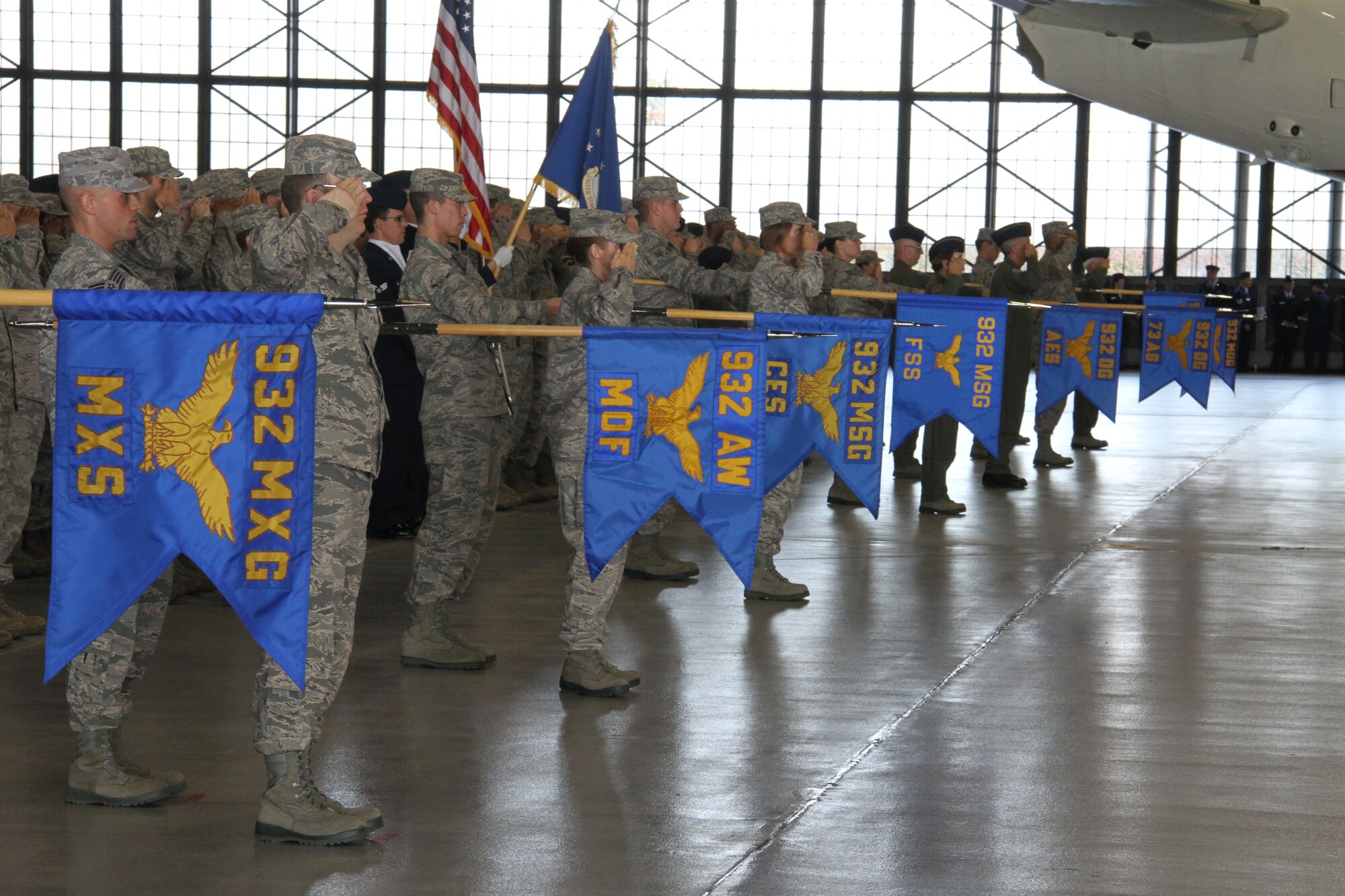 932nd Airlift Wing members present group and squadron  flags during the change-of-command ceremony held Oct. 16 in Hanger One.  Col. Albert V. Lupenski assumed command from Col. William H. Edwards Jr.  (U.S. Air Force photo by Tech. Sgt. Christopher Parr)