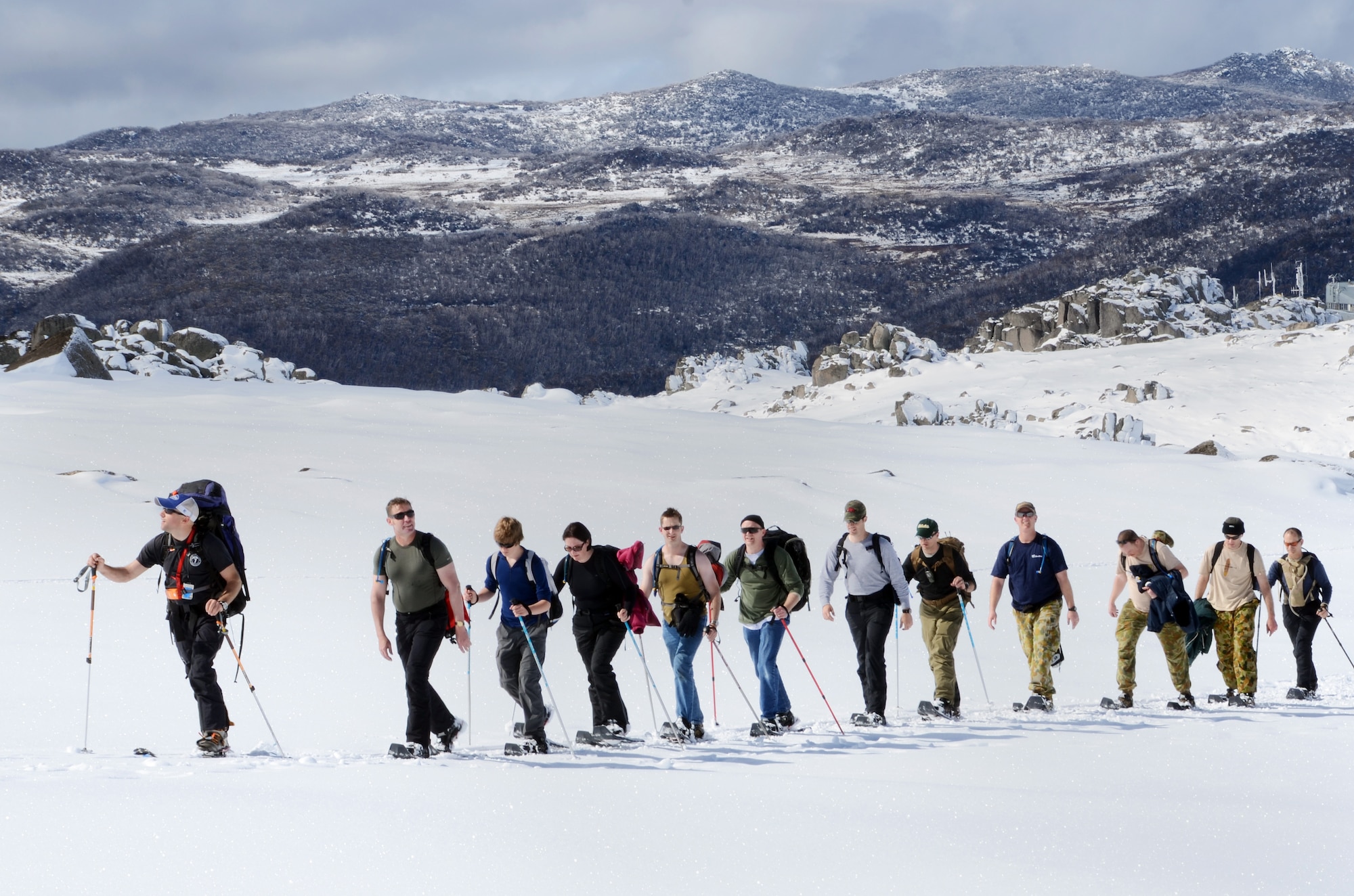Members of the U.S. Air Force 7 Summits Challenge hike with Australian Defense Force soldiers and airmen during their snowy ascent of Australia?s highest peak, Mount Kosciuszko, Oct. 3, 2011.  This was the sixth mountain members of the U.S. Air Force 7 Summits Challenge climbed in their goal of hiking the Seven Summits ? the highest mountain on each continent.  (Courtesy photograph) 