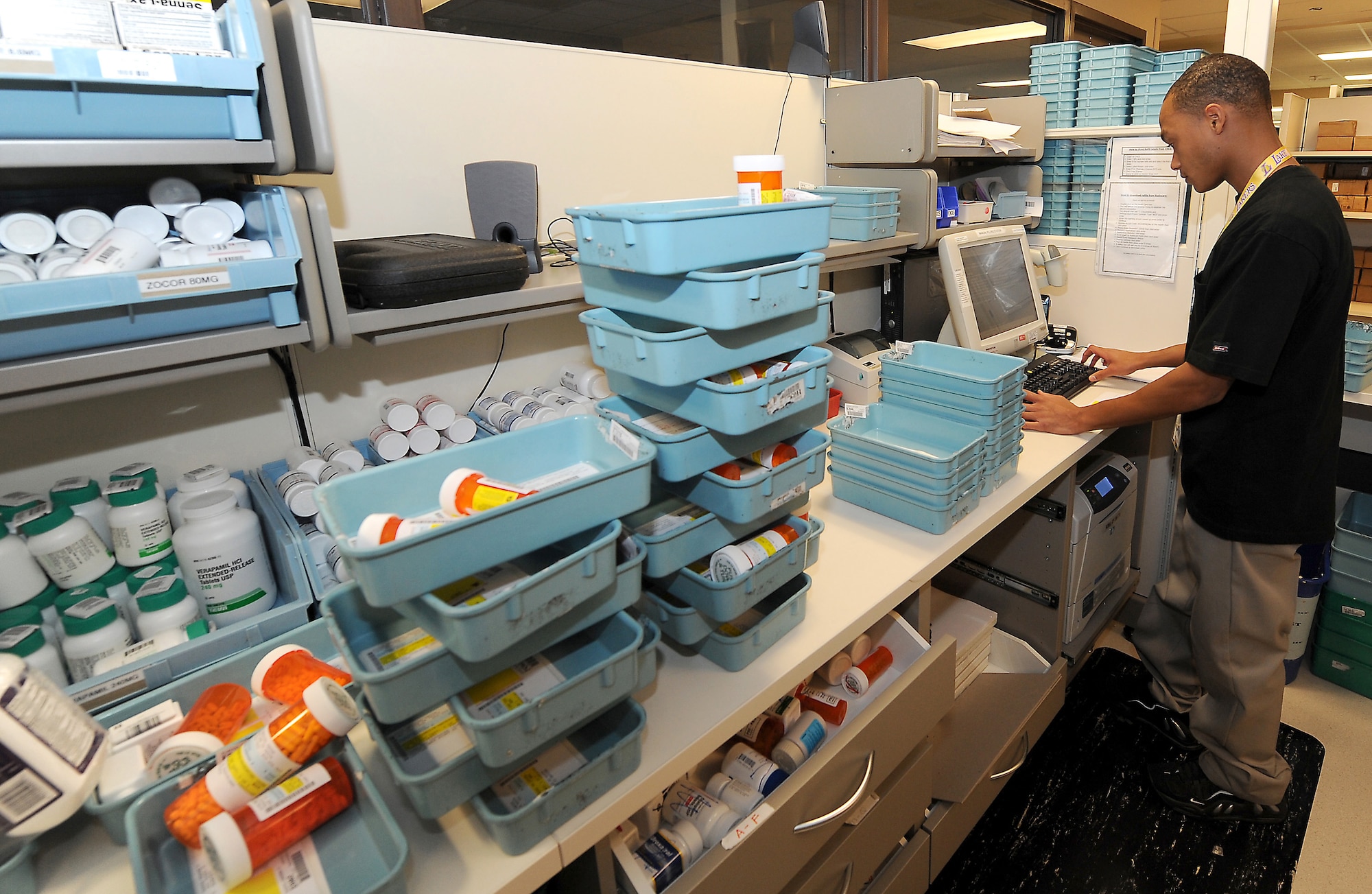 Mario Blount, pharmacy technician, verifies prescription labels Oct. 14 at the David Grant USAF Medical center pharmacy. The medical center processes an average of 2,215 filled and 1,149 refilled prescriptions daily. (U.S. Air Force photo/ Staff Sgt. Liliana Moreno)