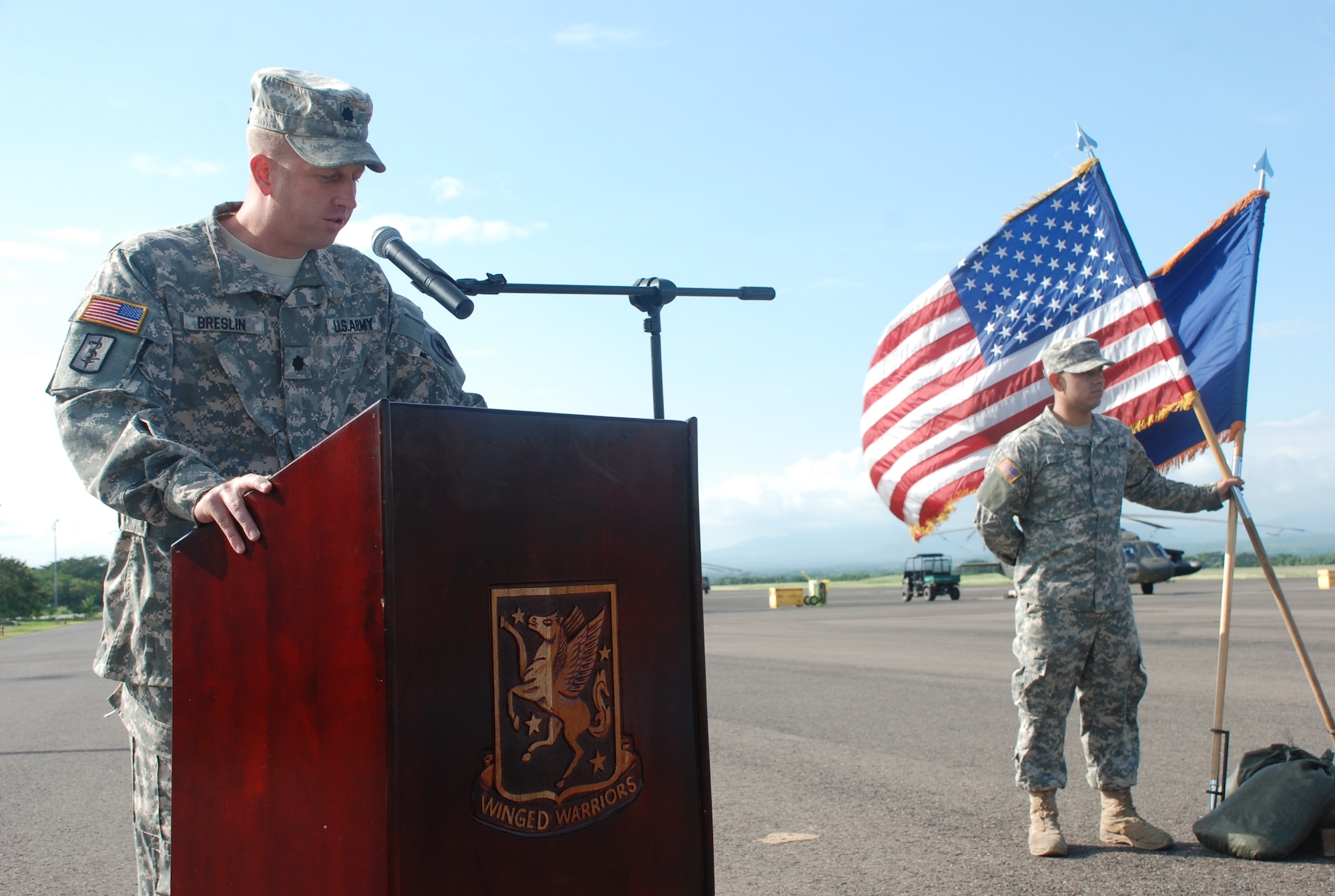 Lt. Col. Michael Breslin, commander of the 1st Battalion, 228th Aviation Regiment,  speaks at a change of command ceremony Oct. 21, 2011, at Soto Cano Air Base, Honduras. Maj. Seth Swartz, company commander, passed the guidon to Capt. Mike Crivello, which symbolized the assumption of command.  (U.S. Air Force photo/Capt. Candice Allen) 
