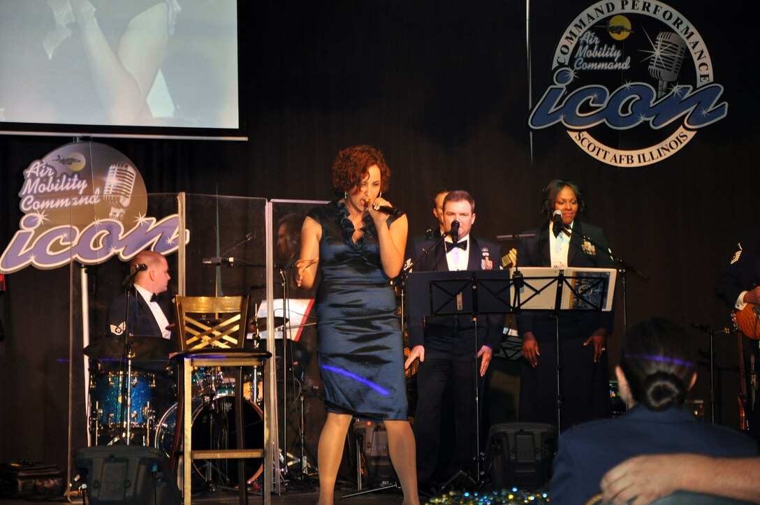 Senior Airman Naomi Scott sings "Rolling in Deep" during the Air Mobility Command Icon finals competition Oct. 20, 2011, at Scott Air Force Base, Ill. Scott made it to the finals by winning the base level competition at Dover AFB, Del., and she took first place in the event. Icon is an AMC commander's initiative to showcase the vocal talents of AMC Airmen. Each AMC base holds Icon contests in July and August to determine their representatives for the command final which takes place at Scott AFB. (U.S. Air Force Photo/Master Sgt. Sabrina D. Foster)