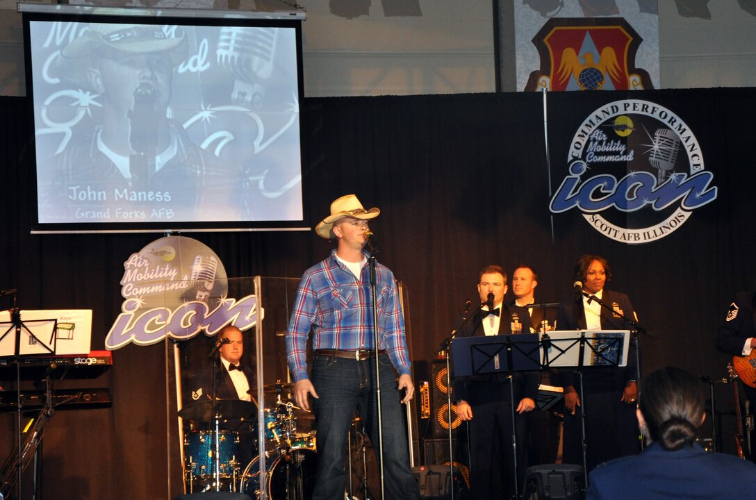 Senior Airman John Maness sings "Muddy Water" during the Air Mobility Command Icon finals competition Oct. 20, 2011, at Scott Air Force Base, Ill. Maness made it to the finals by winning the base level competition at Grand Forks AFB, N.D. Icon is an AMC commander's initiative to showcase the vocal talents of AMC Airmen. Each AMC base holds Icon contests in July and August to determine their representatives for the command final which takes place at Scott AFB. (U.S. Air Force Photo/Master Sgt. Sabrina D. Foster)