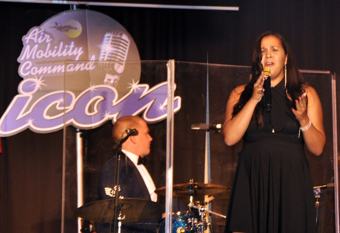 Staff Sgt. Kecia Harris sings "Broken-hearted Girl" during the Air Mobility Command Icon finals competition Oct. 20, 2011, at Scott Air Force Base, Ill. Harris made it to the finals by winning the base level competition at Travis AFB, Calif. Icon is an AMC commander's initiative to showcase the vocal talents of AMC Airmen. Each AMC base holds Icon contests in July and August to determine their representatives for the command final which takes place at Scott AFB. (U.S. Air Force Photo/Master Sgt. Sabrina D. Foster)