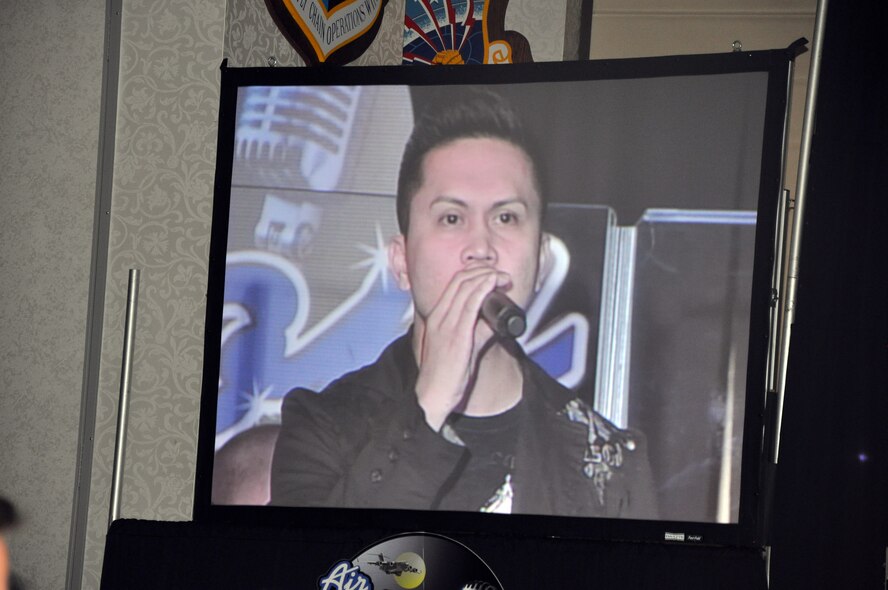 Staff Sgt. Mel Penaflorida sings "Unchained Melody" during the Air Mobility Command Icon finals competition Oct. 20, 2011, at Scott Air Force Base, Ill. Penaflorida made it to the finals by winning the base level competition at Joint Base Charleston, S.C. Icon is an AMC commander's initiative to showcase the vocal talents of AMC Airmen. Each AMC base holds Icon contests in July and August to determine their representatives for the command final which takes place at Scott AFB. (U.S. Air Force Photo/Master Sgt. Sabrina D. Foster)