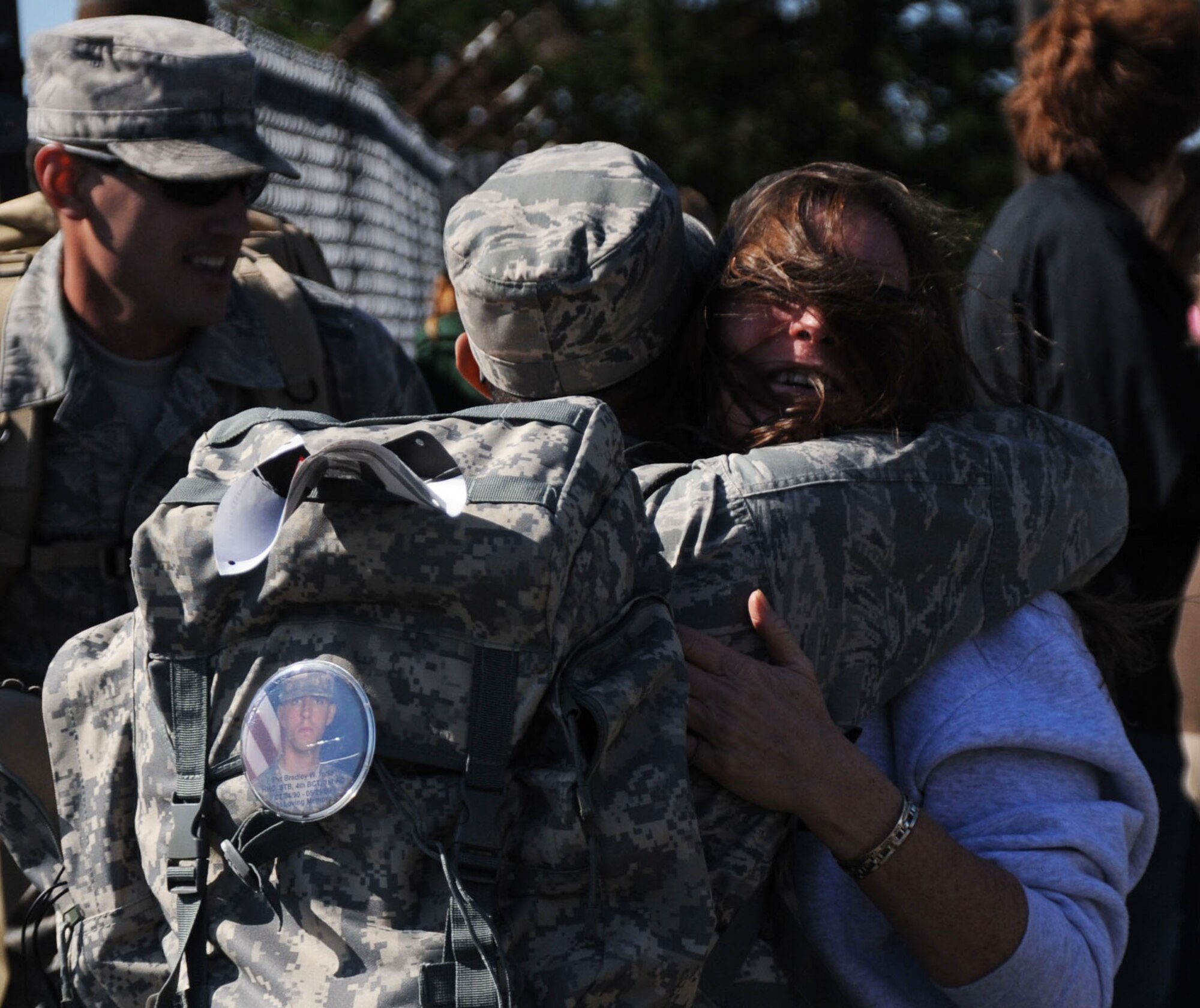 Gold Star Mother Diane Fenton hugs Sgt. 1st Class Brud Nicki, NCO Academy,
while fellow NCO Academy teammates, Staff Sgt. Christopher Trammell, Sgt.
1st Class Christopher Hill and Staff Sgt. Elit Pierre, look on during a
ceremony prior to the 5th Annual Gold Star Mother's Ruck March Oct. 15 here.
The NCO Academy team was running to honor Fenton's son, Marine Sgt. Matthew
J. Fenton, from Little Ferry N.J., who died from wounds received while
conducting combat operation in Anbar Province, Iraq. (U.S. Air Force photo
by James L. Hodges/Released)