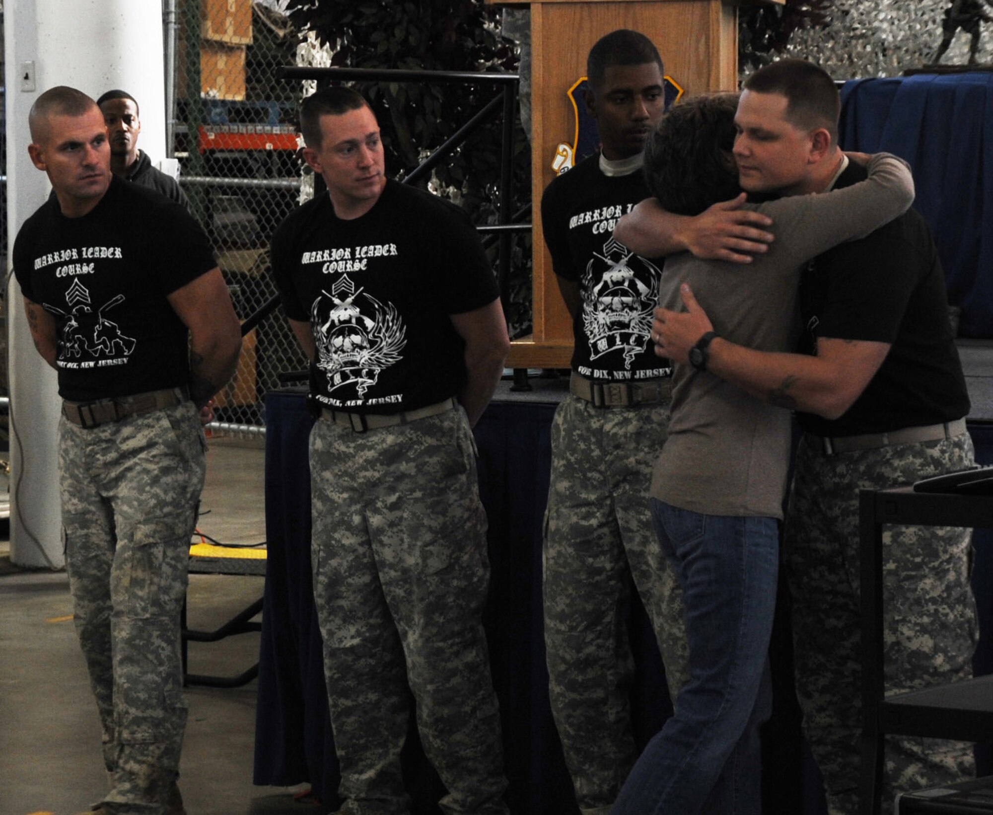 Gold Star Mother Diane Fenton hugs Sgt. 1st Class Brud Nicki, NCO Academy,
while fellow NCO Academy teammates, Staff Sgt. Christopher Trammell, Sgt.
1st Class Christopher Hill and Staff Sgt. Elit Pierre, look on during a
ceremony prior to the 5th Annual Gold Star Mother's Ruck March Oct. 15 here.
The NCO Academy team was running to honor Fenton's son, Marine Sgt. Matthew
J. Fenton, from Little Ferry N.J., who died from wounds received while
conducting combat operation in Anbar Province, Iraq. (U.S. Air Force photo
by James L. Hodges/Released)
