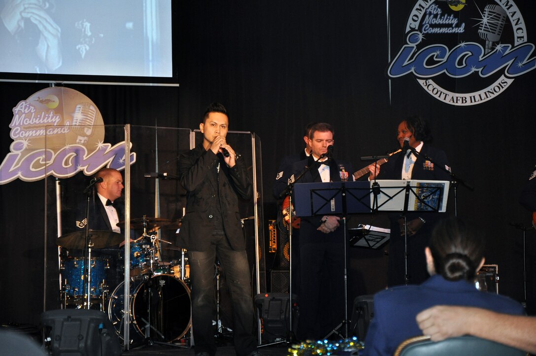 Staff Sgt. Mel Penaflorida sings "Unchained Melody" during the Air Mobility Command Icon finals competition Oct. 20, 2011, at Scott Air Force Base, Ill. Penaflorida made it to the finals by winning the base level competition at Joint Base Charleston, S.C. Icon is an AMC commander's initiative to showcase the vocal talents of AMC Airmen. Each AMC base holds Icon contests in July and August to determine their representatives for the command final which takes place at Scott AFB. (U.S. Air Force Photo/Master Sgt. Sabrina D. Foster)