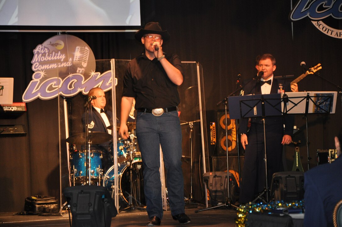 Senior Airman Francis Conrad sings "Without You" during the Air Mobility Command Icon finals competition Oct. 20, 2011, at Scott Air Force Base, Ill. Conrad made it to the finals by winning the base level competition at Joint Base McGuire-Dix-Lakehurst, N.J., and he earned third place in the finals. Icon is an AMC commander's initiative to showcase the vocal talents of AMC Airmen. Each AMC base holds Icon contests in July and August to determine their representatives for the command final which takes place at Scott AFB. (U.S. Air Force Photo/Master Sgt. Sabrina D. Foster)