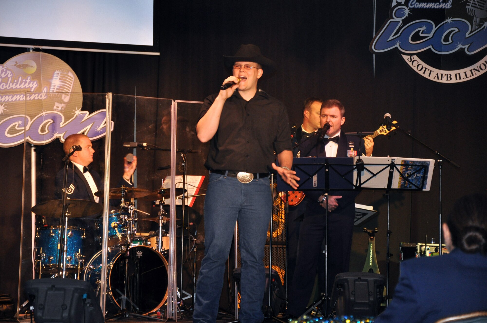 Senior Airman Francis Conrad sings "Without You" during the Air Mobility Command Icon finals competition Oct. 20, 2011, at Scott Air Force Base, Ill. Conrad made it to the finals by winning the base level competition at Joint Base McGuire-Dix-Lakehurst, N.J., and he earned third place in the finals. Icon is an AMC commander's initiative to showcase the vocal talents of AMC Airmen. Each AMC base holds Icon contests in July and August to determine their representatives for the command final which takes place at Scott AFB. (U.S. Air Force Photo/Master Sgt. Sabrina D. Foster)