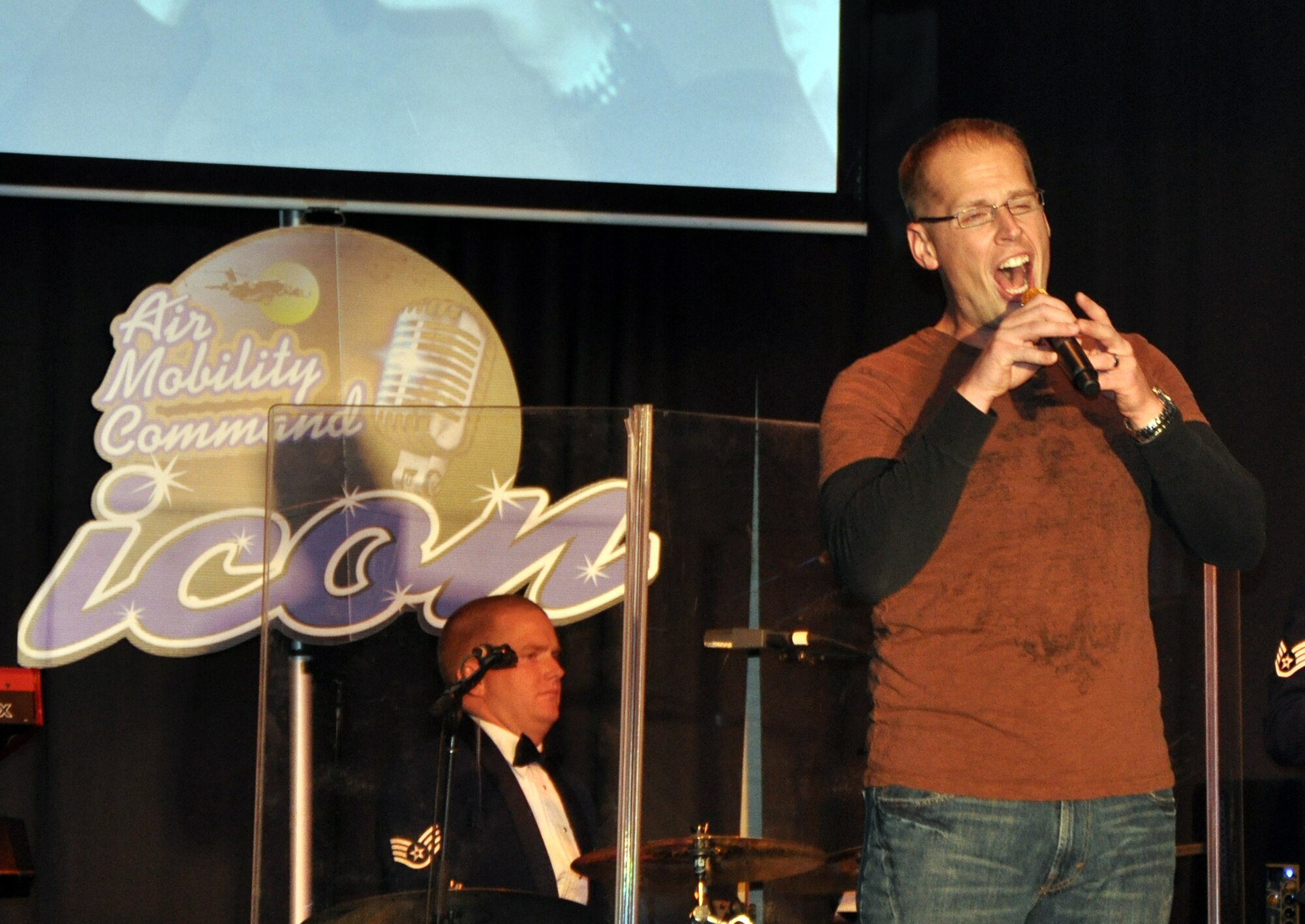 First Lt. Jonathan Lanning sings "Desperado" during the Air Mobility Command Icon finals competition Oct. 20, 2011, at Scott Air Force Base, Ill. Lanning made it to the finals by winning the base level competition at McConnell AFB. Icon is an AMC commander's initiative to showcase the vocal talents of AMC Airmen. Each AMC base holds Icon contests in July and August to determine their representatives for the command final which takes place at Scott AFB. (U.S. Air Force Photo/Master Sgt. Sabrina D. Foster)