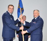 WRIGHT-PATTERSON AIR FORCE BASE, Ohio – Col. Stephen Goeman, 445th Airlift Wing commander, passes the guidon to Col. Scott Sayre, incoming 445th Aerospace Medicine Squadron, during the Oct. 2 Assumption of Command ceremony. Sayre was assigned to the 445th AMDS as the chief dental officer prior to his new position. (U.S. Air Force photo/Senior Airman Matthew Cook)