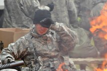 WRIGHT-PATTERSON AIR FORCE BASE, Ohio - Members of 445th Security Forces Squadron warm up around the fire during a weapons maneuver exercise Oct. 1, 2011 at Wright-Patterson Air Force Base, Ohio. (U.S. Air Force Photo/Tech. Sgt. Jeremy Caskey)
