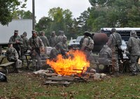 WRIGHT-PATTERSON AIR FORCE BASE, Ohio - Members of 445th Security Forces Squadron warm up around the fire during a weapons maneuver exercise Oct. 1, 2011 at Wright-Patterson Air Force Base, Ohio. (U.S. Air Force Photo/Tech. Sgt. Jeremy Caskey)
