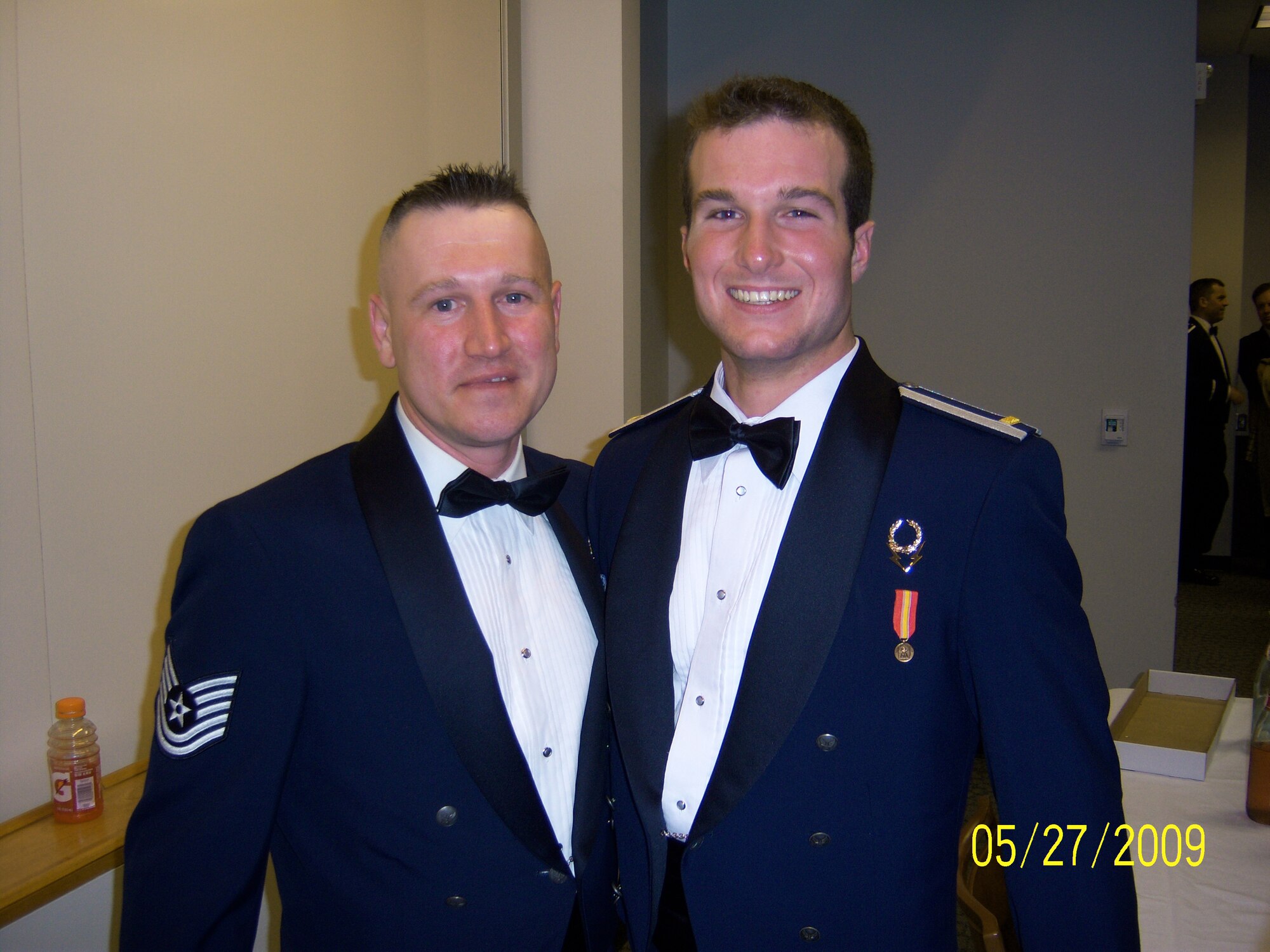 Then Tech. Sgt. David Hall and 2nd Lt. David Nugent together after Nugent’s commissioning ceremony at the U.S. Air Force Academy, Colo. May 27, 2009. Nugent recently performed Hall’s reenlistment ceremony after the two security forces members were reunited at Offutt Air Force Base, Neb. (Courtesy photo)