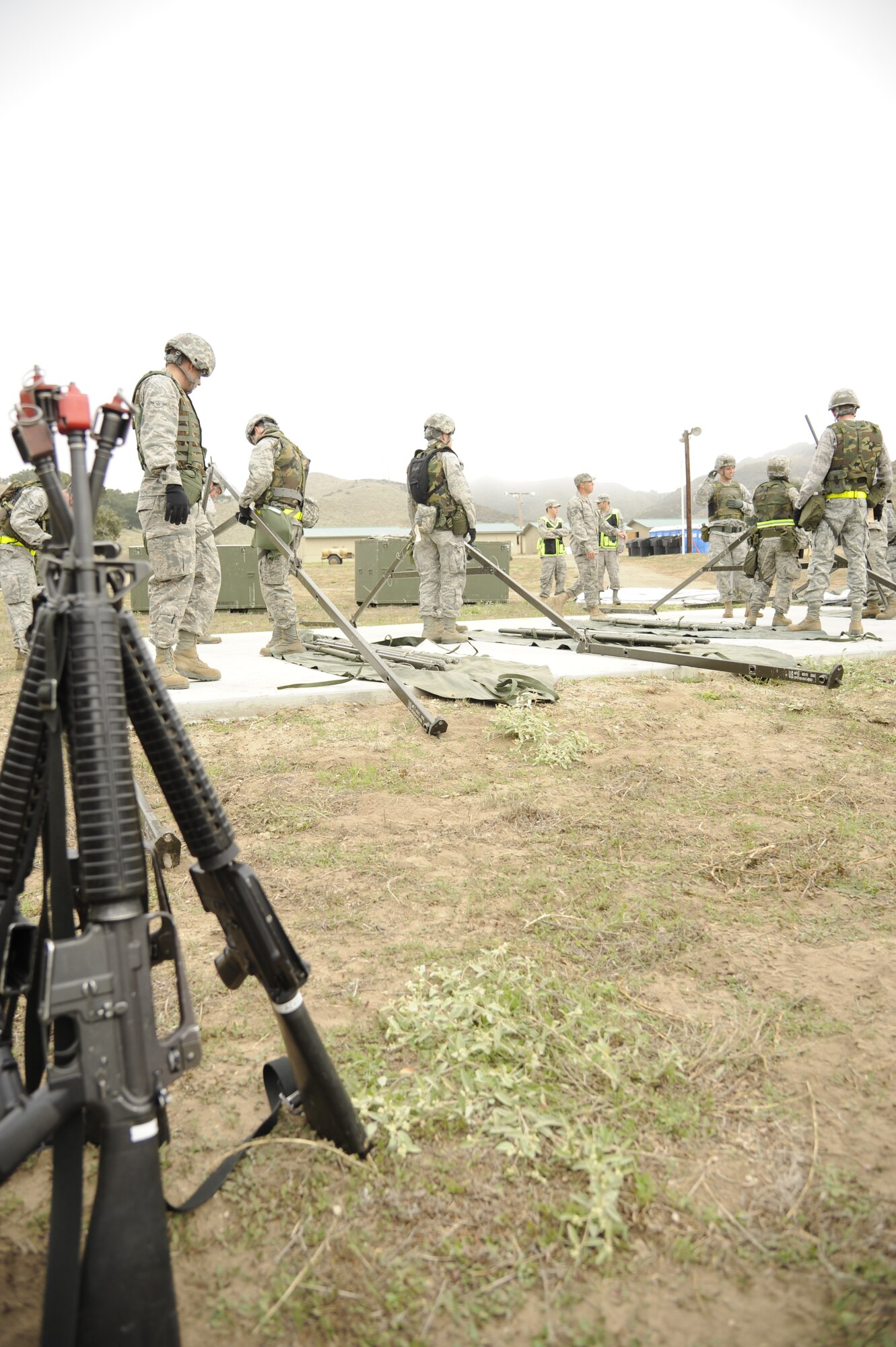 VANDENBERG AIR FORCE BASE, Calif. -- Members of Team V work together to put up a medical tent during a North Star exercise here Thursday, Oct. 20, 2011. The exercise trained Airmen during a simulated deployed environment in which they practiced deployment training and response time. (U.S. Air Force photo/Senior Airman Lael Huss)