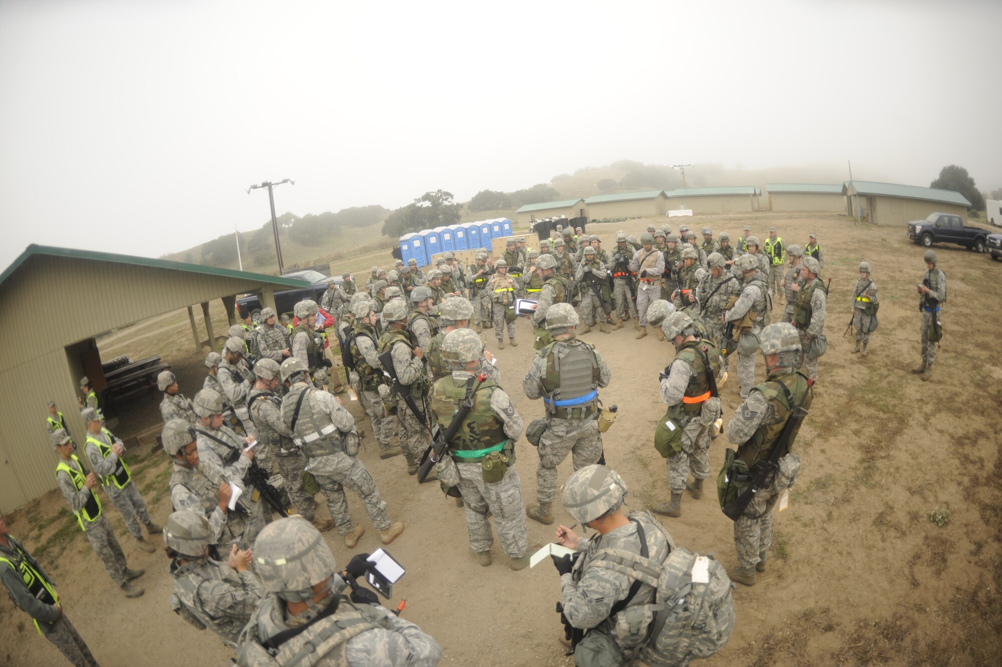 VANDENBERG AIR FORCE BASE, Calif. -- Team V members participating in a North Star exercise gathered for a safety briefing upon arrival and camp set up here Thursday, Oct. 20, 2011. Team V members practiced the skills that they will use in a deployed environment. (U.S. Air Force photo/Senior Airman Lael Huss)