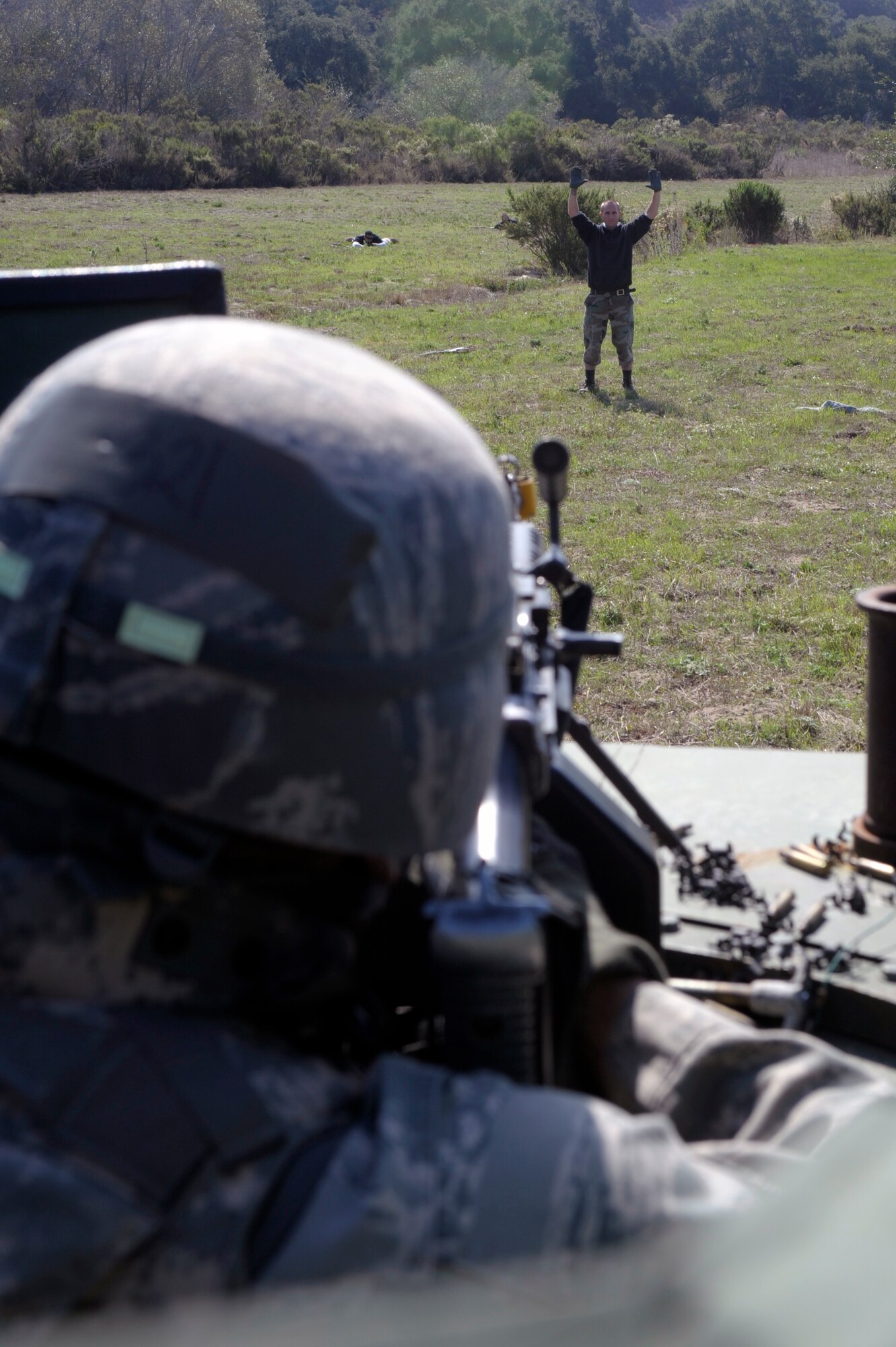 VANDENBERG AIR FORCE BASE, Calif. -- A 30th Security Forces Squadron team member keeps a surrendering enemy covered during an exercise at the North Star training area here Thursday, Oct. 20, 2011. 
(U.S. Air Force photo/Jerry E. Clemens, Jr.)