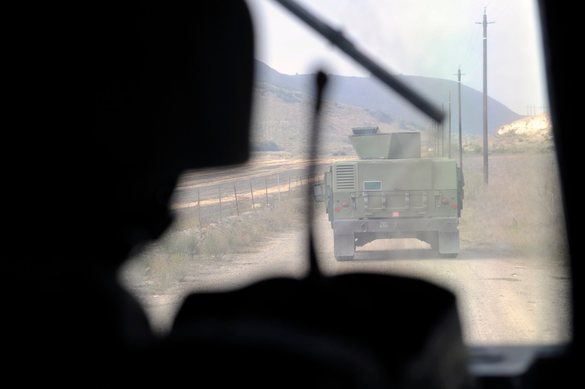 VANDENBERG AIR FORCE BASE, Calif. -- Team members from the 30th Security Forces Squadron travel by convoy outside-the-wire to recover a downed pilot during an exercise at the North Star training area here Thursday, Oct. 20, 2011. 
(U.S. Air Force photo/Jerry E. Clemens, Jr.)