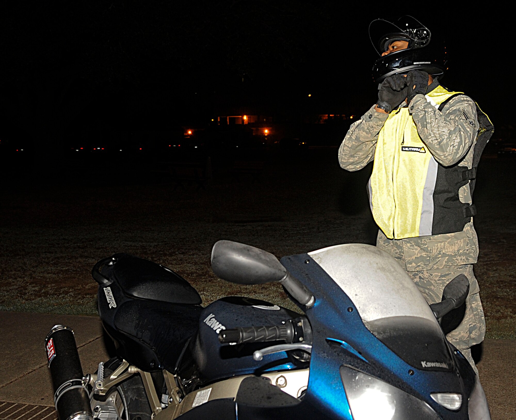 Airman 1st Class Marcus Robins, 2nd Logistics Readiness Squadron, fastens the chin strap on his helmet before heading to work on Barksdale Air Force Base, La., Oct. 20. Motorcycle riders on base must wear proper personal protective equipment. All active and reserve military personnel must comply with the PPE requirements on and off base both on and off duty. (U.S. Air Force photo/Senior Airman Kristin High)(RELEASED)
