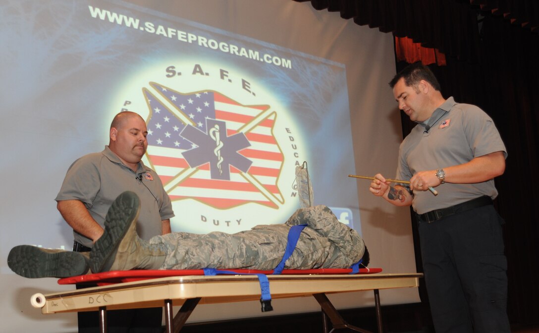 Paramedics from Orlando, Fla. and founders of the “Street Smart” program, Scott McIntyre and Joseph McCluan, role played for their “Street Smart” program presentation to “Team Fairchild” with the help of Airman Andrew Olvera, 92nd Force Support Squadron Oct. 17 at the base theater. The presentation focused on bad decisions such as drinking and driving. (U.S. Air Force photo/Earlandez M. Young)