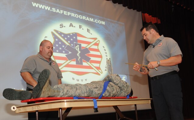 Paramedics from Orlando, Fla. and founders of the “Street Smart” program, Scott McIntyre and Joseph McCluan, role played for their “Street Smart” program presentation to “Team Fairchild” with the help of Airman Andrew Olvera, 92nd Force Support Squadron Oct. 17, 2011, at the base theater. The presentation focused on bad decisions such as drinking and driving. (U.S. Air Force photo/Earlandez M. Young)