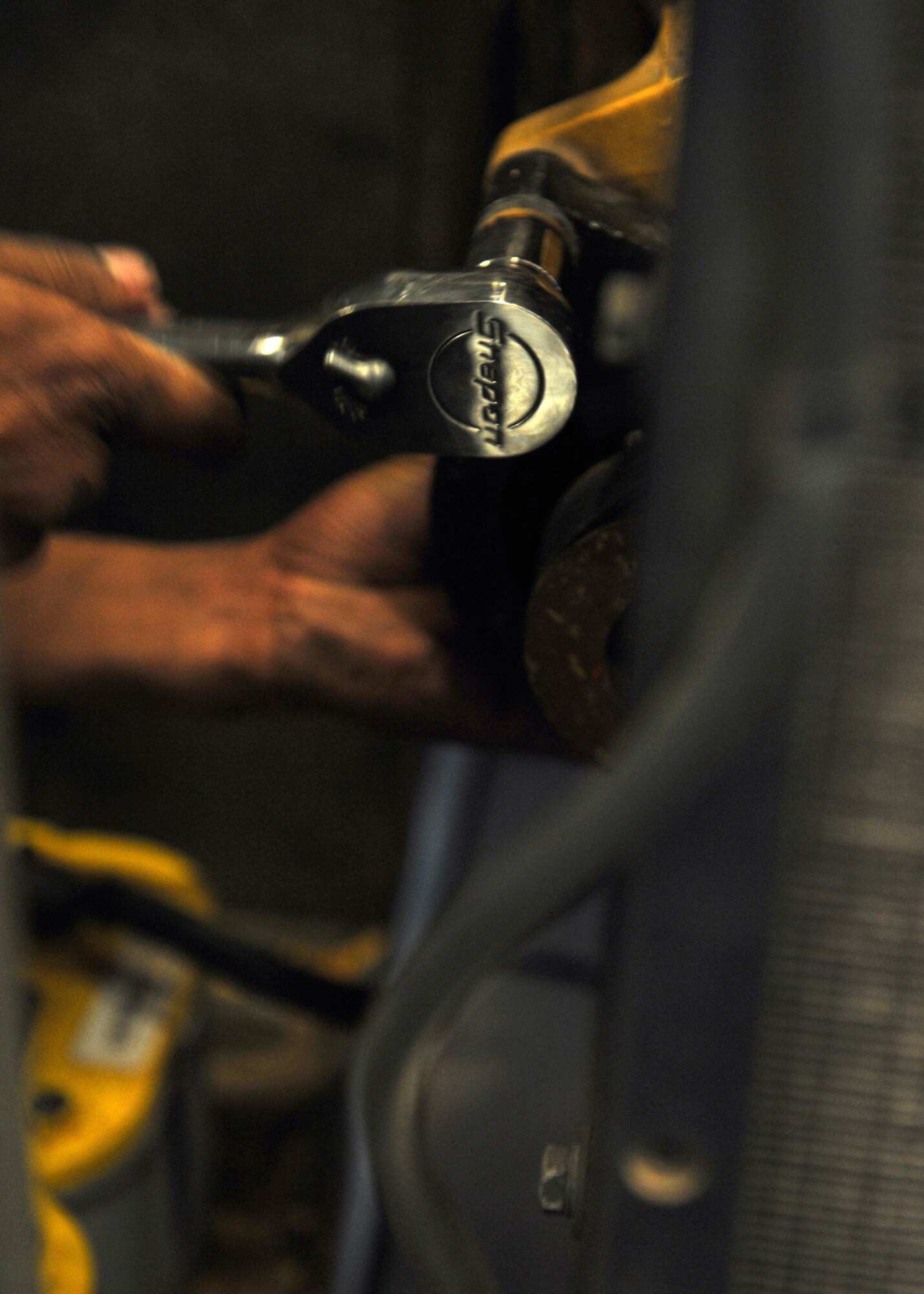 Airman 1st Class Anirude Sukhdeo, 7th Equipment Maintenance Squadron, replaces a belt on a diesel heater Oct. 18, 2011 at Dyess Air Force Base, Texas.  The 7 EMS provides aircraft equipment maintenance assuring mission readiness for B-1s and C-130s. (U.S. Air Force photo by Airman 1st Class Jonathan Stefanko/ Released)