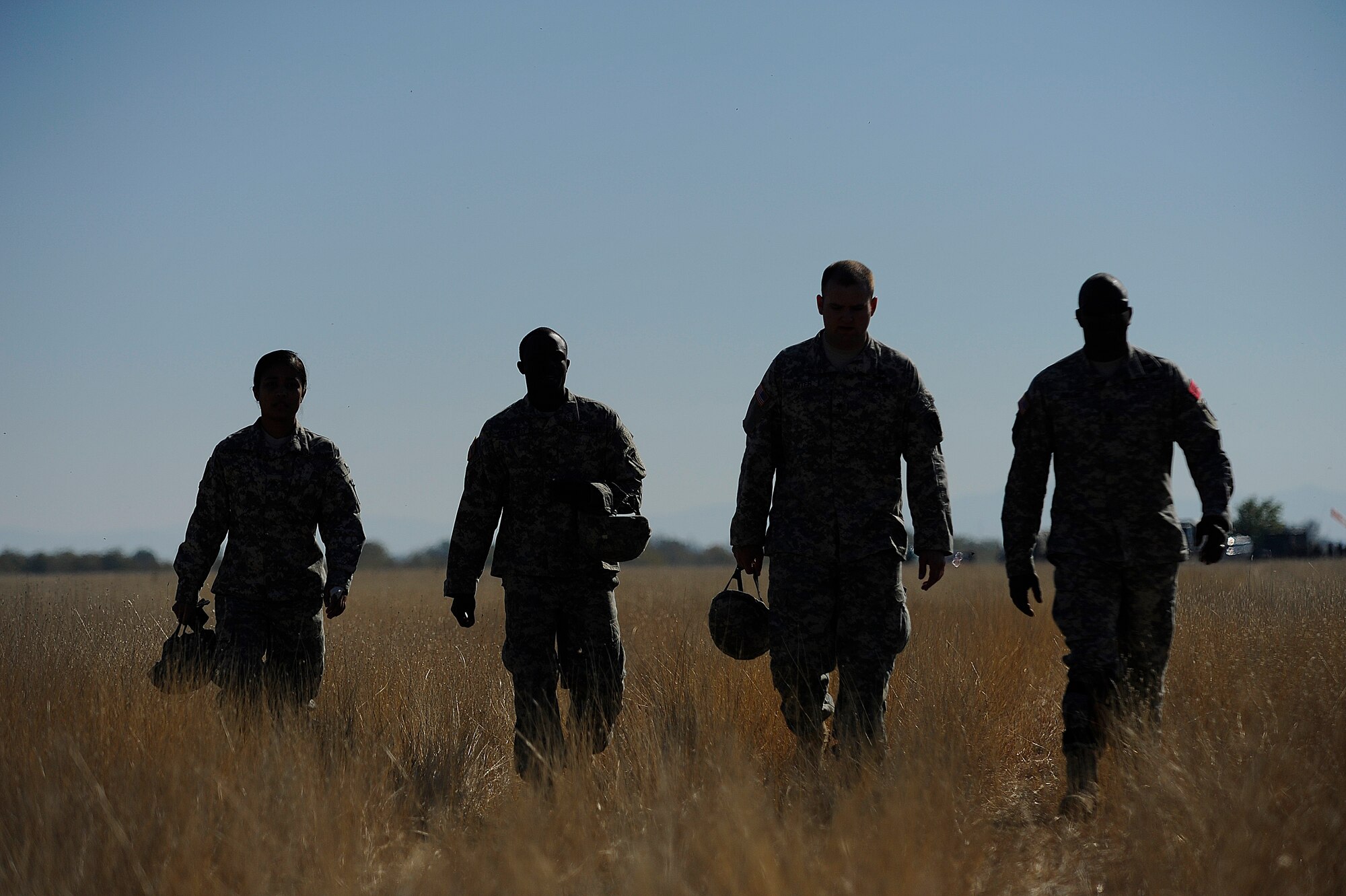 Army soldiers from the 5th Quartermaster Det. Special Troops Battalion, 21st Theater Support Command return to the drop zone during Operation Thracian Fall 2011, Oct. 20, 2011, Plovdiv, Bulgaria. OTF11 is off-station training designed to enhance interoperability between U.S. and Bulgarian Air Forces as well as build partnerships with paratroopers from both. (U.S. Air Force photo by Senior Airman Stephen J. Otero)