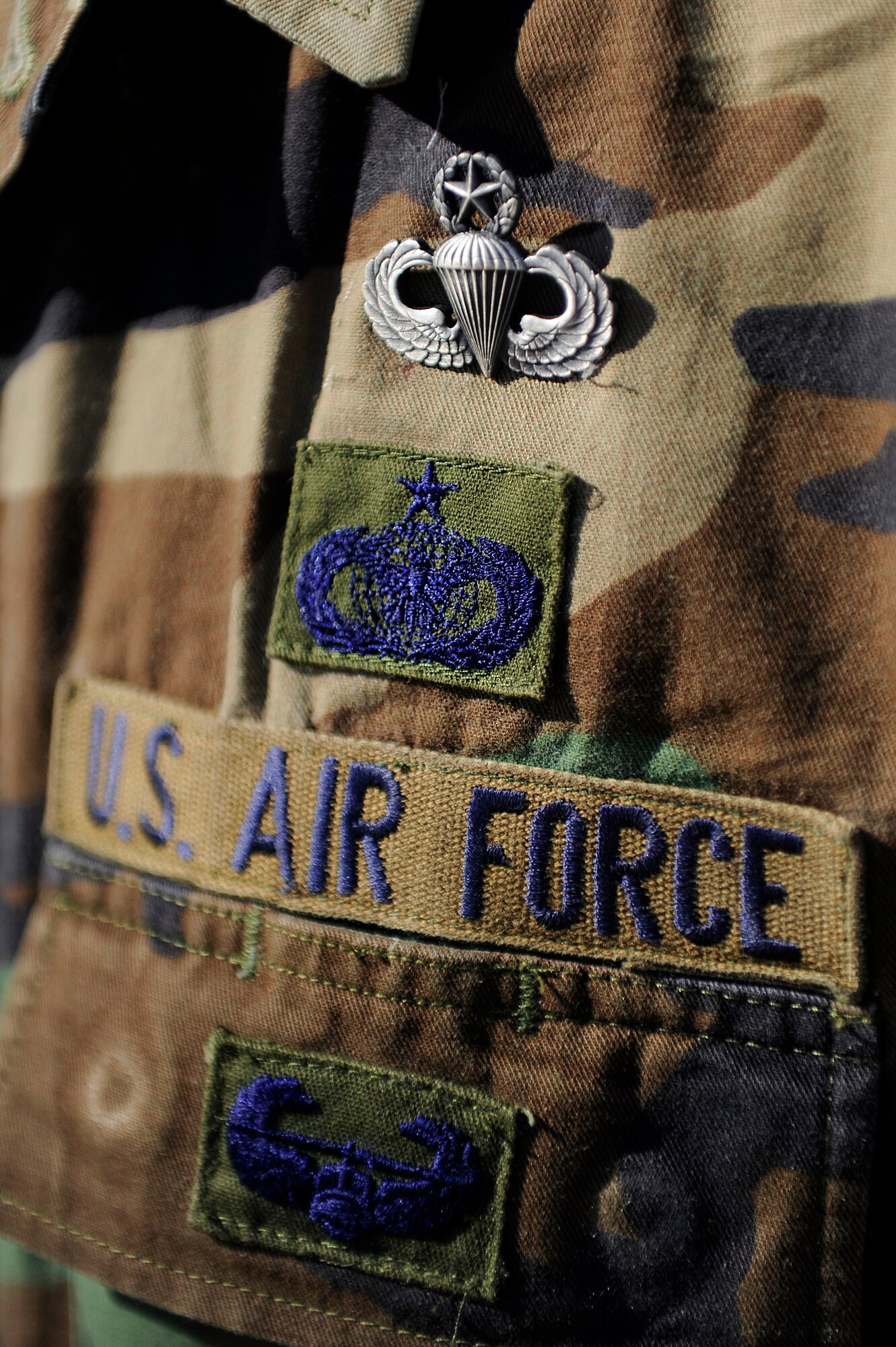 Staff Sgt. Nick Hurst wears his master parachutist badge during Operation Thracian Fall 2011, Oct. 20, 2011, Plovdiv, Bulgaria. Hurst earned his master rating after completing his 65th static line jump. OTF11 is off-station training designed to enhance interoperability between U.S. and Bulgarian Air Forces as well as build partnerships with paratroopers from both. (U.S. Air Force photo by Senior Airman Stephen J. Otero)