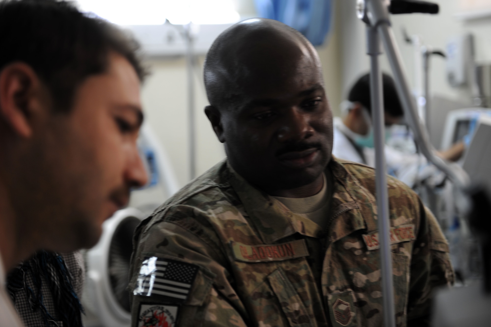 Master Sgt. Oladayo Oladokun, respiratory therapist for the Special Operations Critical Care Evacuation Team, shows an Afghan doctor how to operate a new respiratory machine in the intensive care unit of the Afghan National Army hospital in Herat, Afghanistan, October 10, 2011. Oladokun is deployed from the 1st Special Operations Support Squadron at Hurlburt Field, Fla. He's a native of Bronx, NY. (U.S. Air Force photo/ Senior Airman Patrick McKenna)