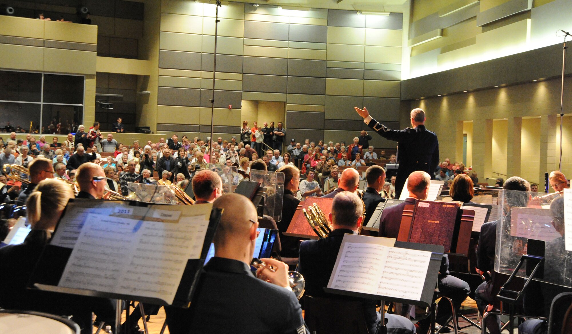 Col. A. Philip Waite, U.S. Air Force Band commander and conductor, honors Sidney, Neb., veterans at Sidney High School Oct. 19 during a performance on the USAF Band's 2011 Fall Tour. The concert was the 14th on the band's 25-day community relations tour across Montana, Wyoming, Nebraska and South Dakota. (U.S. Air Force photo by Airman 1st Class Tabitha N. Haynes)

