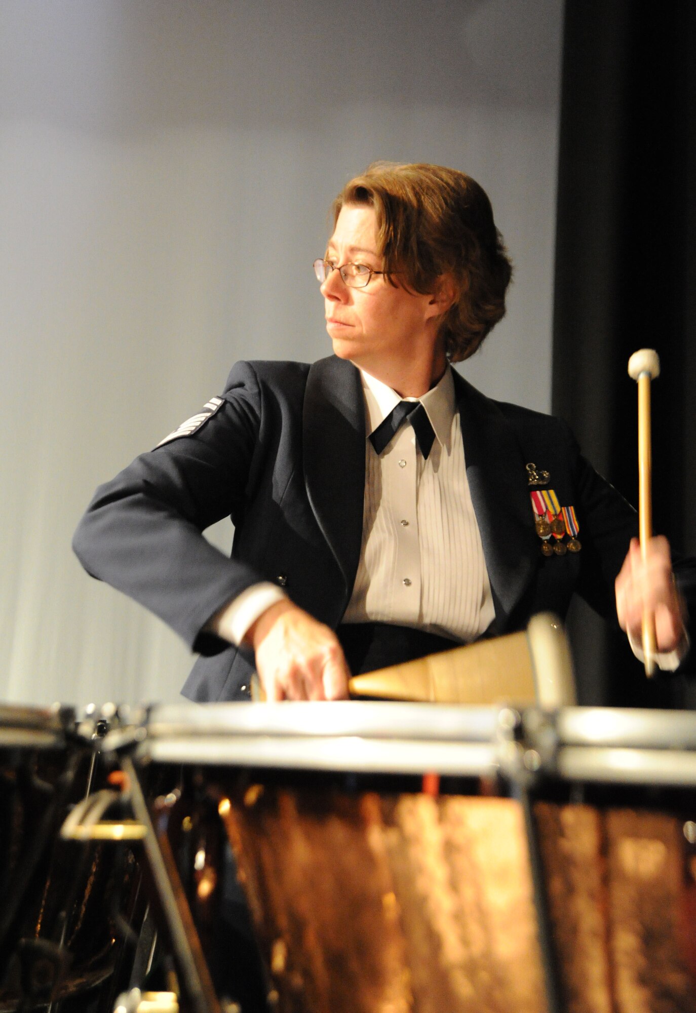 Senior Master Sgt. Erica Montgomery, U.S. Air Force Band percussionist, plays Oct. 19 at Sidney High School, Sidney, Neb. Montgomery and the other concert band servicemembers are traveling on their 2011 Fall Tour to honor veterans, inspire patriotism, and showcase the Air Force mission. (U.S. Air Force photo by Airman 1st Class Tabitha N. Haynes)

