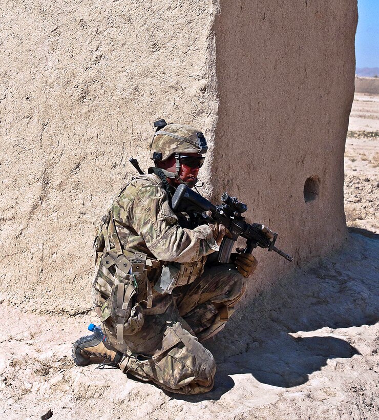 U.S. Army Sgt. Justin Yazza guards his sector in a small village during Operation Shamshir in the Deh Yak district of Ghazni province, Afghanistan, Oct. 19, 2011. Yazza is assigned to the 1st Cavalry Division.