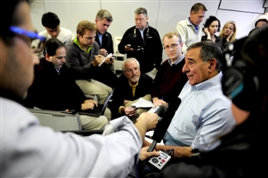U.S. Defense Secretary Leon E. Panetta conducts a press conference with reporters aboard a U.S. Air Force E-4B aircraft on his way to visit with defense leaders and U.S. troops stationed in the Asia-Pacific region, Oct. 21, 2011. Panetta discussed the U.S. troop withdrawal from Iraq, NATO operations in Libya, and the importance of U.S. alliances with Indonesia, Japan and South Korea. Panetta issued a statement on Iraq as well.
