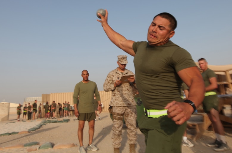 Cpl. Robert Esparza, a combat engineer with 7th Engineer Support Battalion, 2nd Marine Logistics Group (Forward), hurls an 8 lb. shot put during the Iron Man Competition aboard Camp Leatherneck, Afghanistan, Oct. 22. The 2nd MLG (FWD) hosted the event, which was open to all who wished to test their might against fellow warrior athletes. (U.S. Marine Corps photo by Sgt. Justin J. Shemanski)