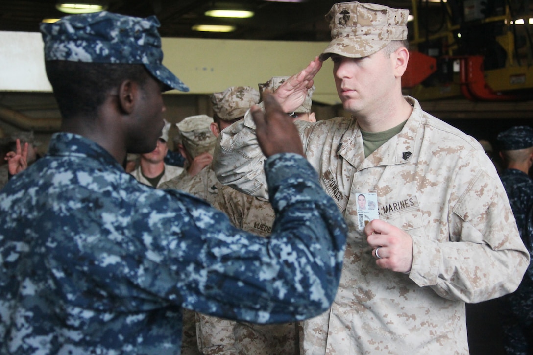 Staff Sgt. Zhivonne Edwards, the operations supply chief with 2nd Marine Logistics Group (Forward), throws shotput as part of the Iron Man competition held aboard Camp Leatherneck, Afghanistan, Oct. 22.  The event also included bench press, pull-ups, sit-ups and running competitions.  (U.S. Marine Corps photo by Cpl. Katherine M. Solano)