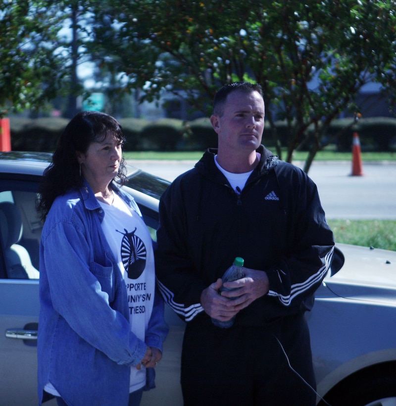 Gunnery Sgt. James J. Dacey, company gunnery sergeant for Support Company, 8th Engineer Support Battalion, 2nd Marine Logistics Group, stands with his mother, Debbie Melamed, aboard Camp Lejeune, N.C., Oct. 22, 2011, before his 345-mile run to National Naval Medical Center, Bethesda, Md. The North Arlington, N.J., native is conducting the run to raise awareness about our nation’s wounded warriors and for the service members we’ve lost to the war. (U.S. Marine Corps photo by Pfc. Franklin E. Mercado)