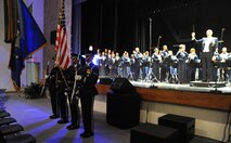 The U.S. Air Force Honor Guard Color Team stands at the position of present arms during the National Anthem Oct. 21 at the Tassel Performing Arts Certer, Holdrege, Neb. The colors team traveled with the U.S. Air Force Band on their 25-day community relations tour honoring veterans, inspiring patriatism all while showcasing the Air Force mission. (U.S. Air Force photo by Airman 1st Class Tabitha N. Haynes)
