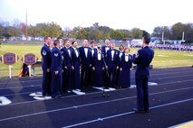 The U.S. Air Force Band Singing Sergeants perform the National Anthem Oct. 21 at Holdrege High School, Holdrege, Neb., for the Friday night football game. The USAF Band selected Holdrege from the Midwestern U.S. as one of the communities along their 2011 Fall Tour across Montana, Wyoming, Nebraska and South Dakota to showcase the Air Force mission. (U.S. Air Force photo by Airman 1st Class Tabitha N. Haynes)