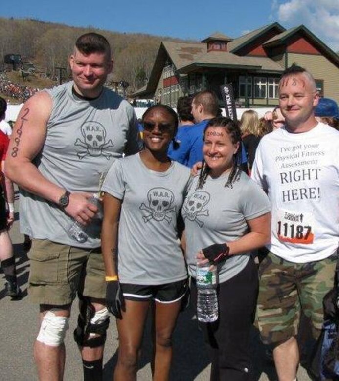 Members of the 157 Air Refueling Wing take on the 'Tough Mudder' competition on Mother's Day. Pictured from left to right, 2nd Lt. Jeff Hill, TSgt. Hope Townes, SSgt. Melinda Fuller, and SSgt. Sean Avery.   Photo courtesy of SSgt. Fuller.
