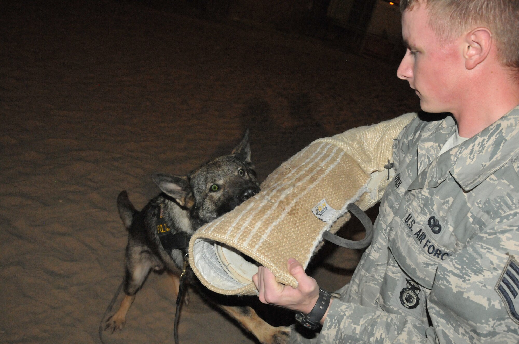 Staff Sgt. Steven Owen, 332nd Expeditionary Security Forces Squadron military working dog handler, trains with MWD Errol at an undisclosed location in Southwest Asia Oct. 13, 2011. Owen is deployed from Offutt Air Force Base, Neb., and is a native of Kansas City, Kan. (U.S. Air Force photo by 1st Lt. Rusty Ridley)