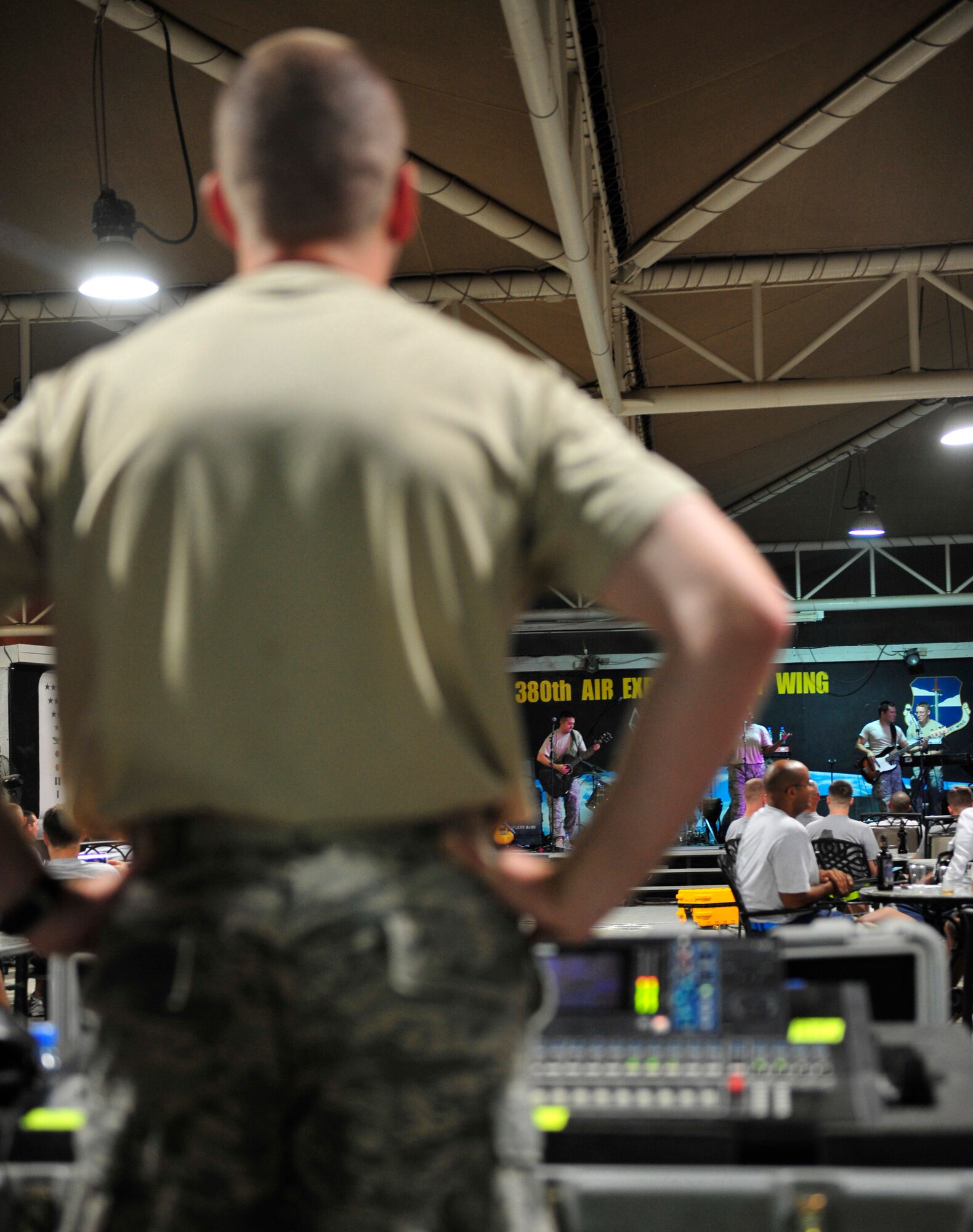 Staff Sgt. Joshua Deal, the audio technician for Top Cover, the U.S. Air Forces Central Command band, ensures the levels are correct for the band?s prime time performance, Oct. 19, 2011, at the 380th Air Expeditionary Wing in Southwest Asia. The band played several small acoustic sets at back shops and a pair of full-length powered shows during their visit to the wing to raise the morale of the deployed Airmen, Soldiers and Sailors at the wing. (U.S. Air Force photo/Tech. Sgt. Patrick Mitchell)