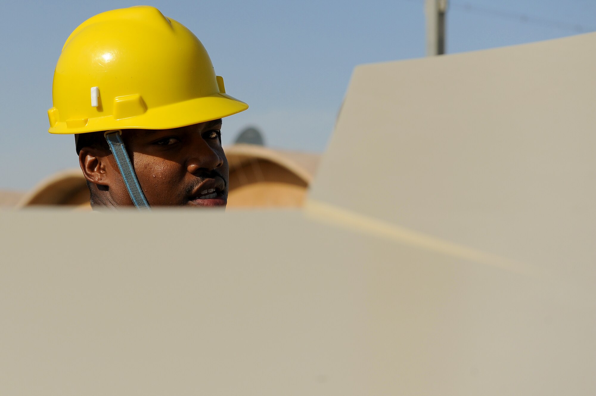 Airman 1st Class Chris Howard, 5th Combat Communications Group, Robins Air Force Base, Ga., assembles a tactical satellite communications called a ground multiband terminal, or GMT, at Sather Air Base, Iraq, Oct. 7, 2011. The tactical communications network is being set up for Airmen on the ground as the U.S. military continues preparation for the scheduled withdrawal. Howard is from Wichita, Kan. (U.S. Air Force photo/Staff Sgt. Mike Meares)