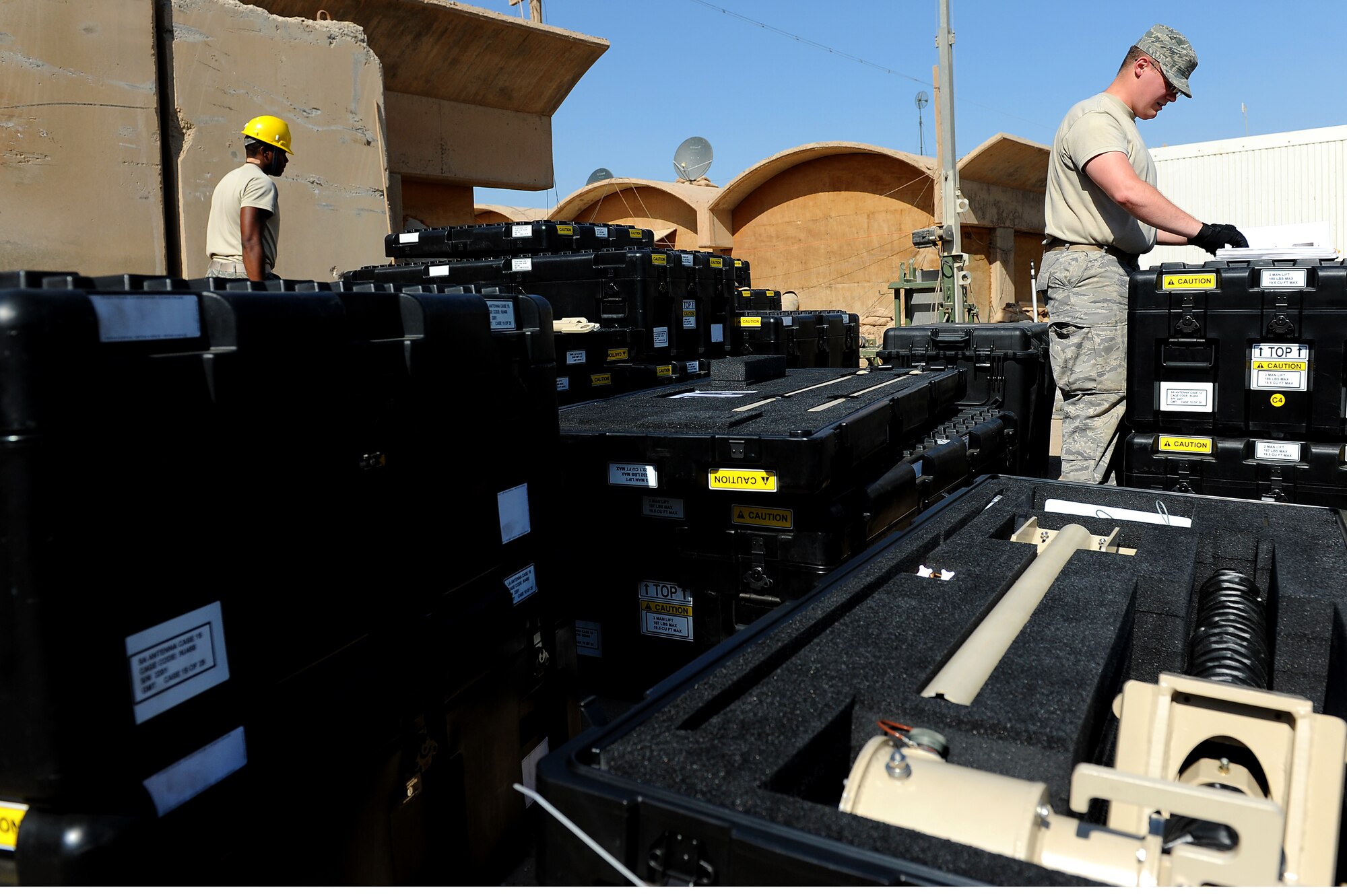 Senior Airman Drew Wilshire, 5th Combat Communications Group, Robins Air Force Base, Ga., unpacks pieces of a tactical satellite communications called a ground multiband terminal, or GMT, at Sather Air Base, Iraq, Oct. 7, 2011. The tactical communications network is being set up for Airmen on the ground as the U.S. military continues preparation for the scheduled withdrawal. (U.S. Air Force photo/Staff Sgt. Mike Meares)