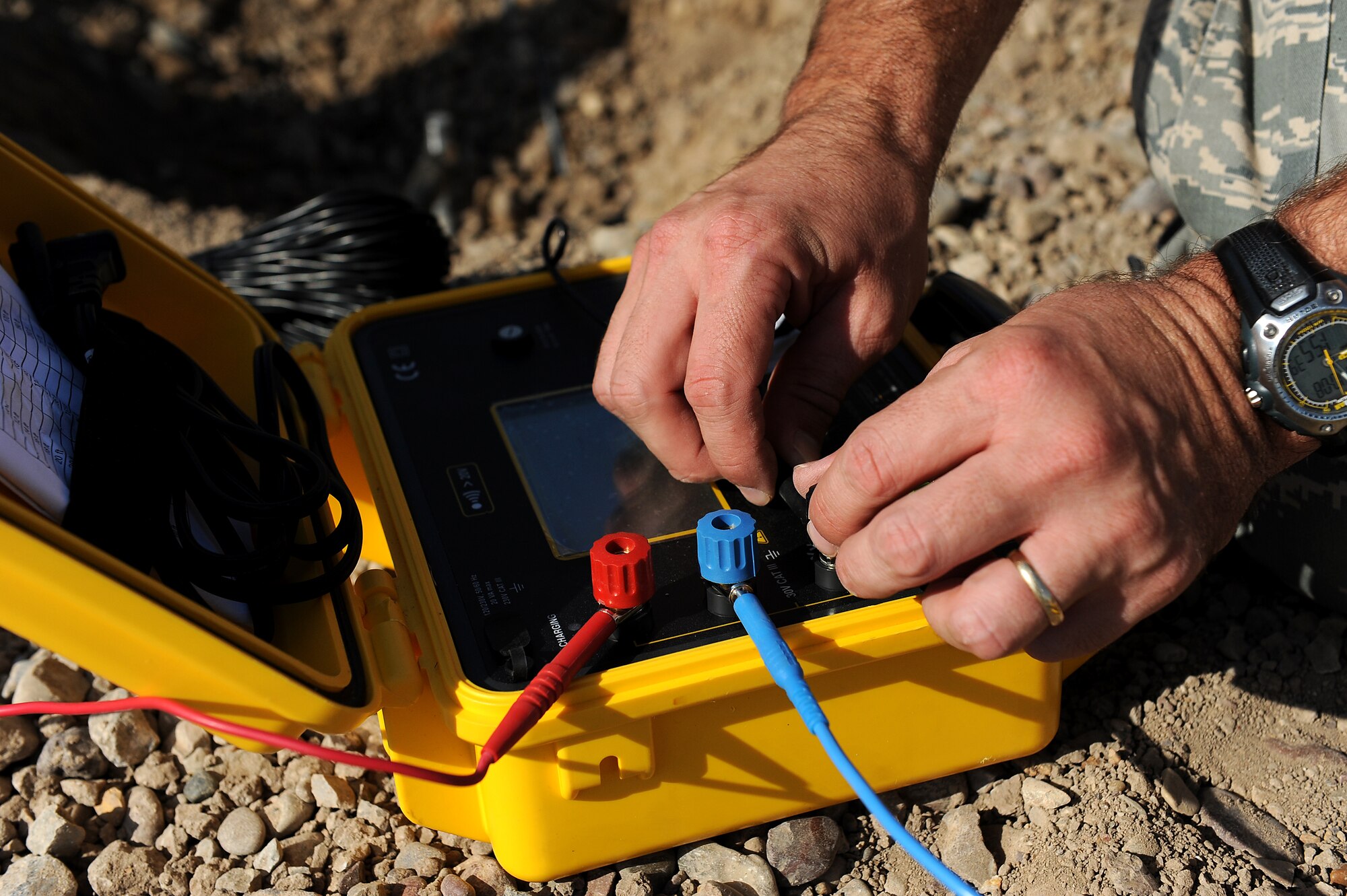 Tech. Sgt. Shawn Gambill, 5th Combat Communications Group, prepares to test the grounding rods installed for a tactical communications satellite terminal Oct. 7, 2011, at Sather Air Base, Iraq. The tactical communications network is being set up for Airmen currently on the ground as the U.S. military continues preparation for the scheduled withdrawal. Gambill is deployed from Robins Air Force Base, Ga., and calls Macon, Ga., home. (U.S. Air Force photo/Staff Sgt. Mike Meares)