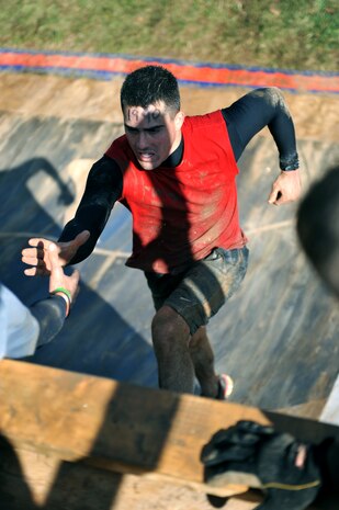 Lance Cpl. Logan Sierra, Company A ceremonial marcher, runs up a quarterpipe during Tough Mudder at Wintergreen, Va., Oct. 22, 2011. Tough Mudder, a 10-mile race through rough terrain and 27 obstacles, was the 12th of 17 events that compose Marine Barracks Washington's 2011 Commander's Cup.