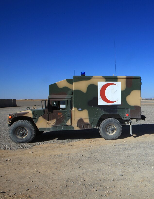 The crescent moon symbol on the side of an ambulance distinguishes it between other tactical vehicles aboard Forward Operating Base Delaram, Afghanistan, Oct. 23.  The symbol is meant to ward off attacks on the vehicle, granting medical personnel and those they treat a safe passage under the Geneva Convention.  (U.S. Marine Corps photo by Cpl. Katherine M. Solano)