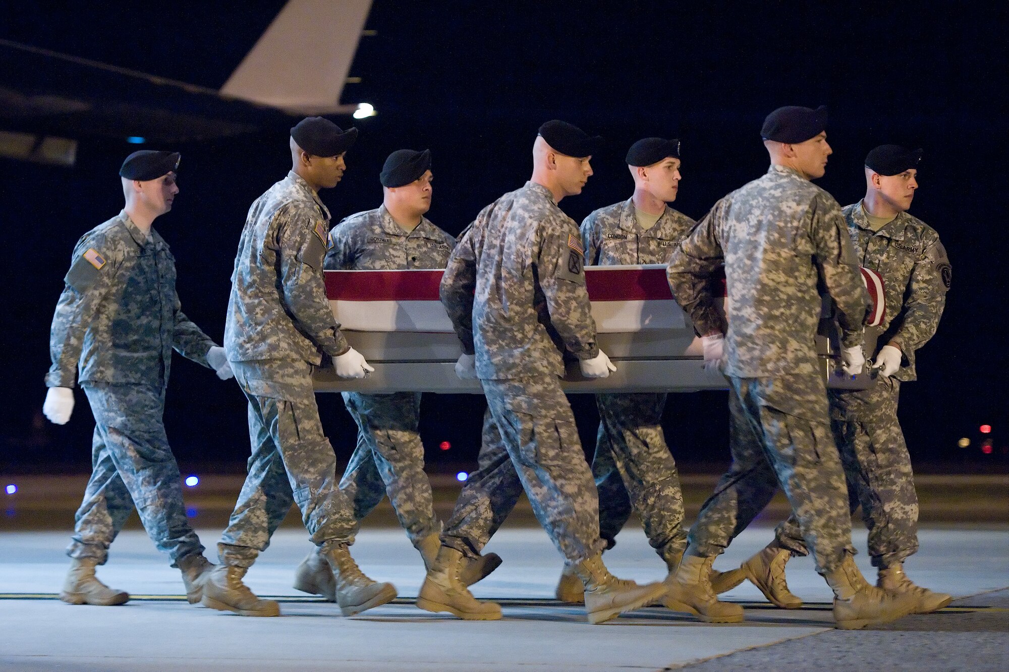 A U.S. Army carry team transfers the remains of Army Pfc. Christopher A. Horns, of Colorado Springs, Colo., at Dover Air Force Base, Del., Oct. 23, 2011. Horns was assigned to the 2nd Battalion, 75th Ranger Regiment, Joint Base Lewis-McChord, Wash. (U.S. Air Force photo/Roland Balik)
